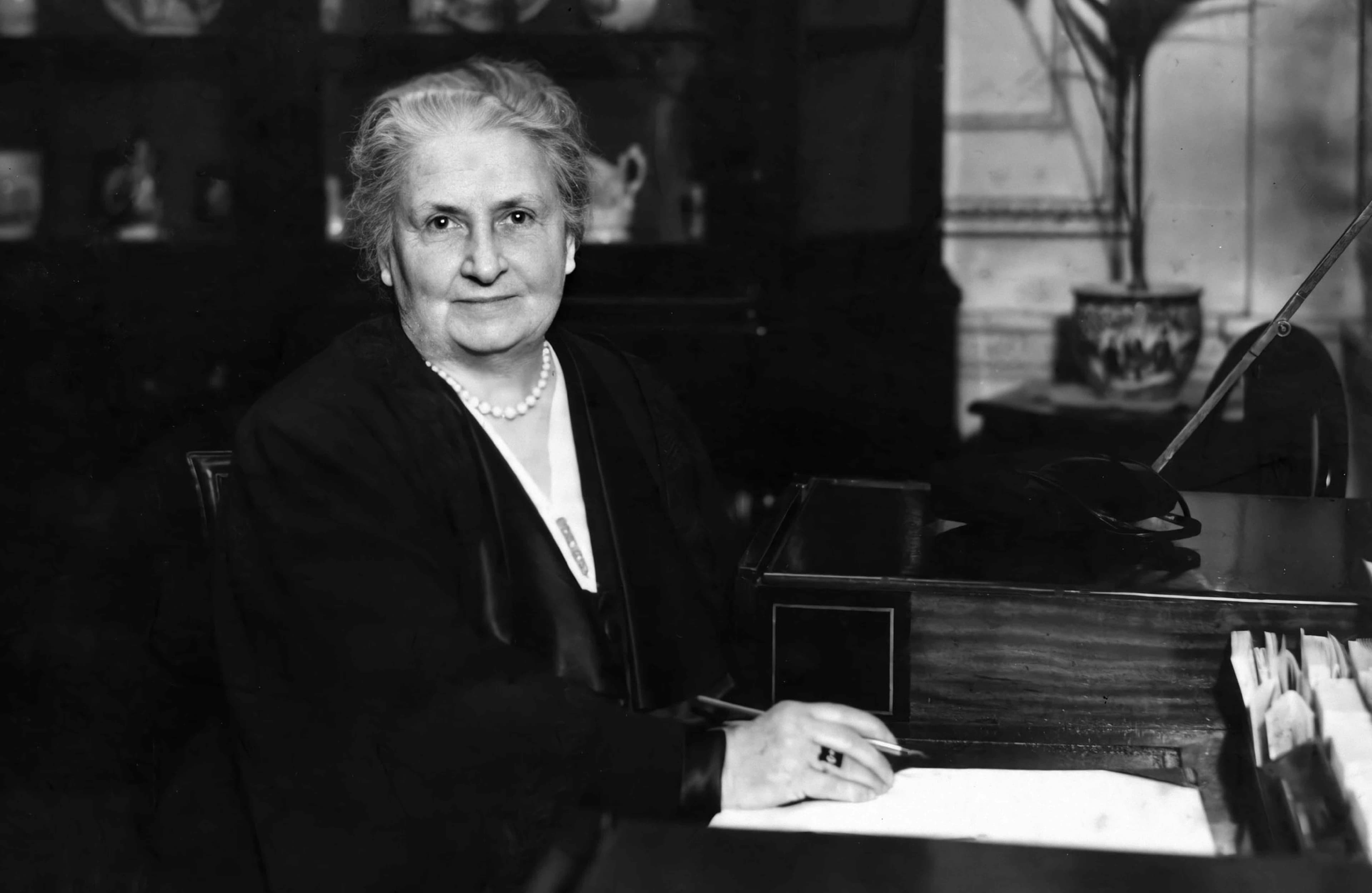 An old black-and-white photo of Maria Montessori.